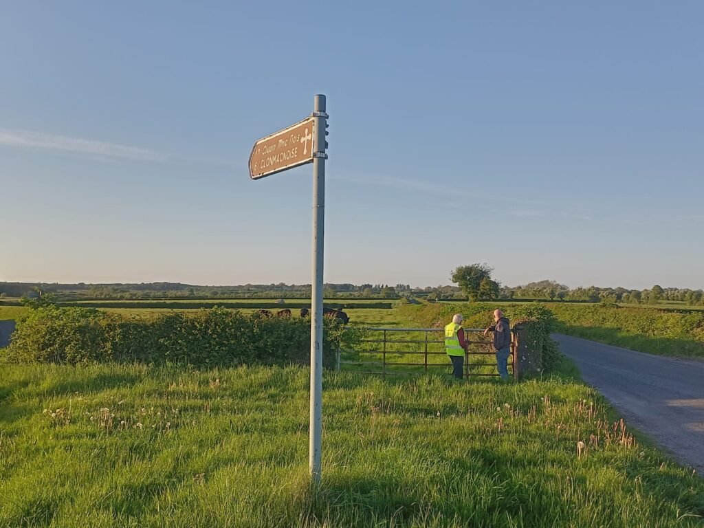 Paul and his dad checking out new cattle with Clonmacnoise sign at front